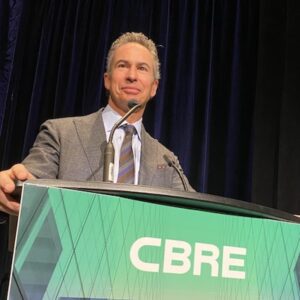A man speaking at the CBRE event